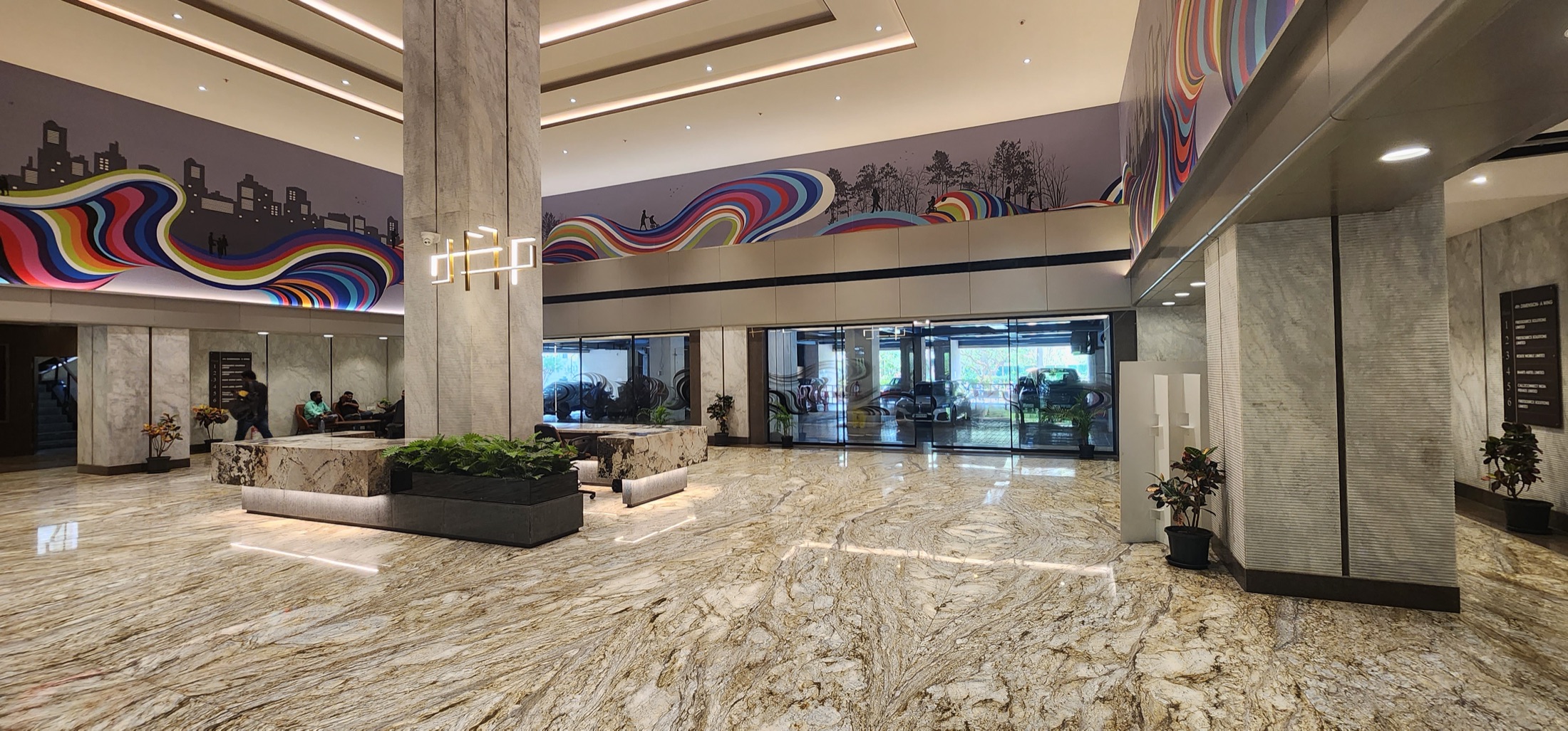 Grand marble lobby with colourful mural ceiling band