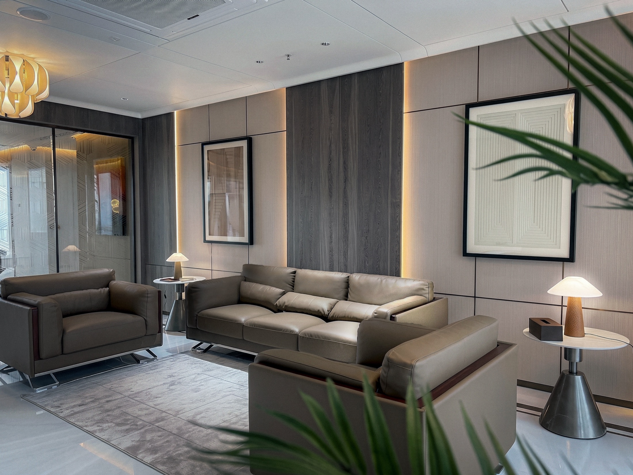 Waiting lounge with leather sofas and framed wall art