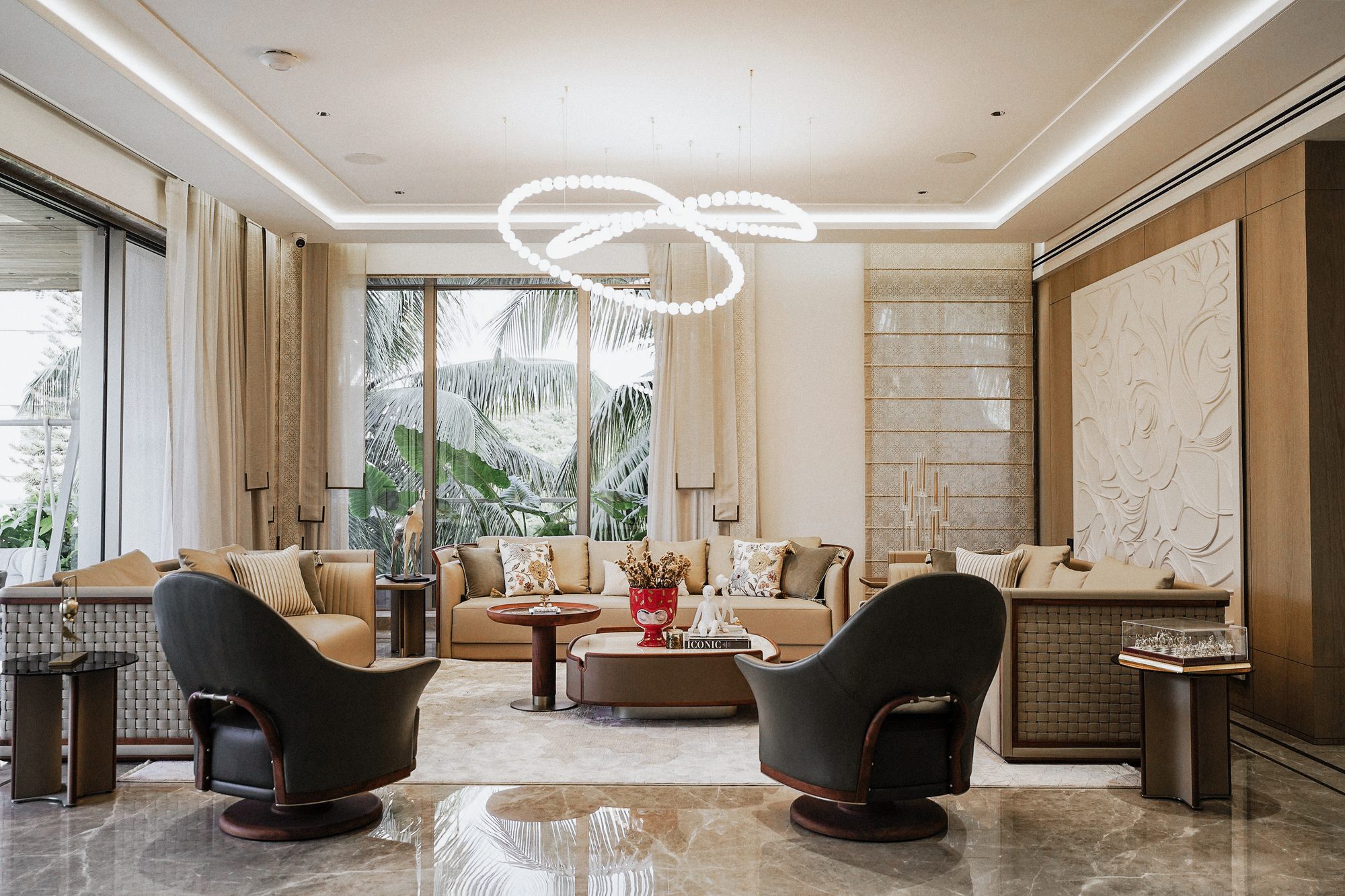 Living room with tan leather sofas facing a garden of palms